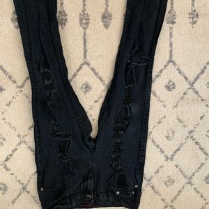 Distressed black jeans,